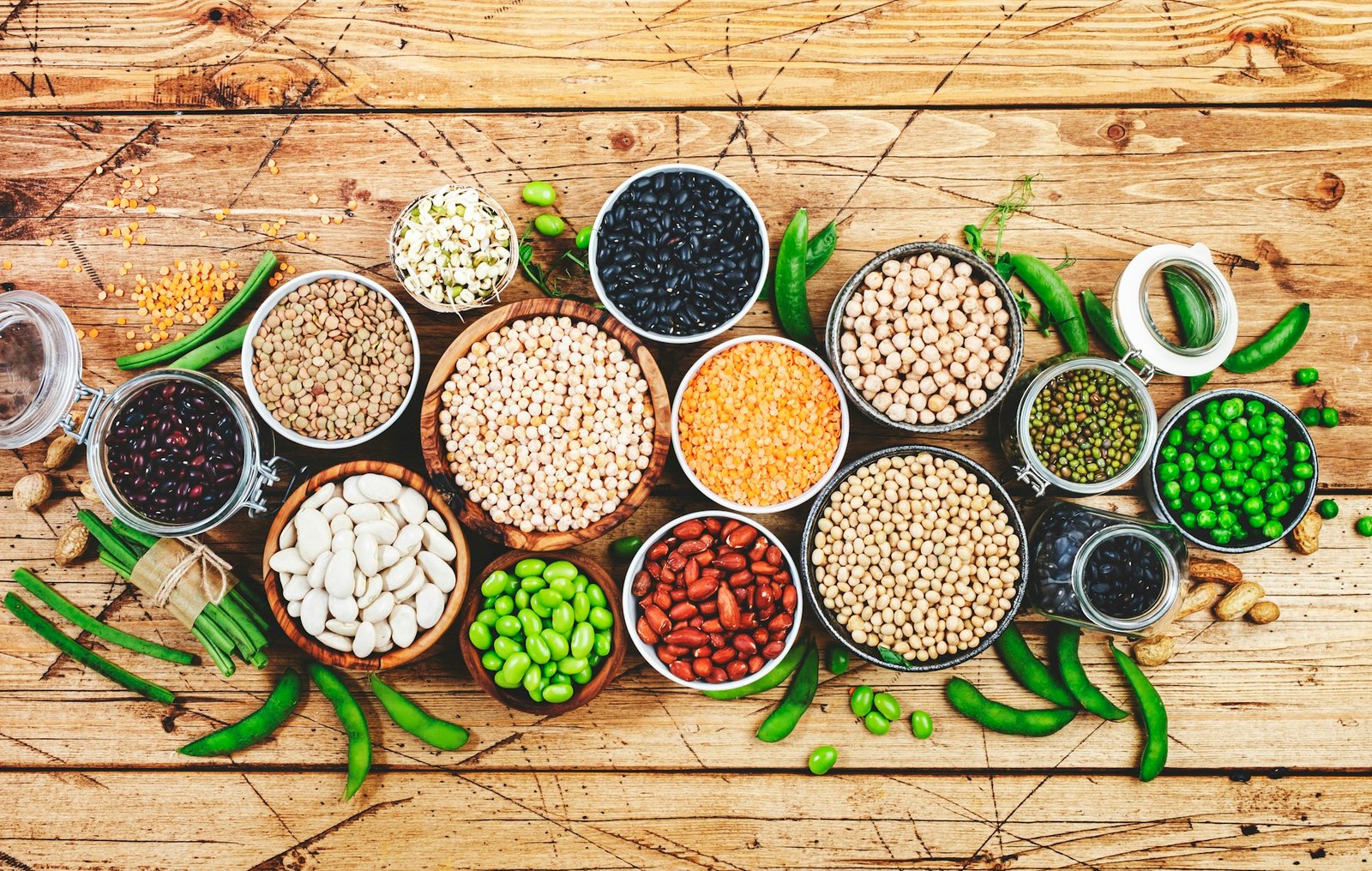 Legumes, beans and sprouts. Dried, raw and fresh, top view. Red beans, lentils, mung beans